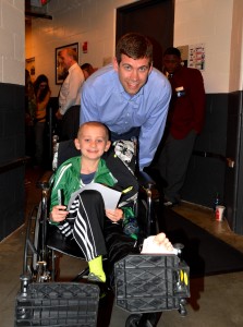 Brad Stevens taking pose with Biggest Fan for Celtics